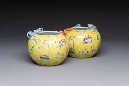 A pair of Chinese famille rose yellow-ground water pots with floral design and applied chilong and b