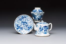 A Chinese blue and white 'Buddhist Lion' teapot, covered bowl and a saucer, various marks, 19th C.