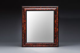 A large rectangular tortoiseshell-veneered and ebonised wood frame with later mirror, probably Fland