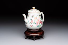 A Chinese famille rose 'Birds and Insects among Flowers' teapot on a later wooden stand, Yongzheng