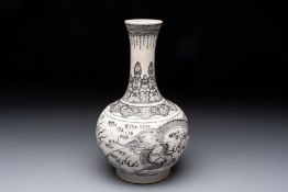 A Chinese black-enamelled biscuit 'Dragon' vase, Kangxi mark, 19th C.