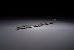 A large Chinese archaic bronze dragon-shaped fitting, early Western Zhou