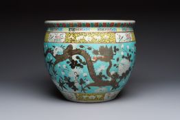 A Chinese famille rose turquoise-ground Dayazhai-style 'Dragons' fish bowl or jardiniere, 19th C.