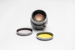 A Leica Summicron 50 mm F2 LTM lens with adapter to Leica M and two Leica filters