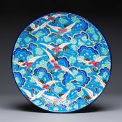 A French polychrome enamelled Longwy 'Cranes among Clouds' charger, 20th C.