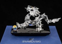 SWAROVSKI CRYSTAL DRAGON on BLACK BASE. model 5063670, approx. 9 (h) x 15cms (w) Provenance: private