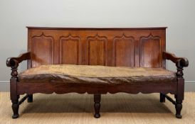 18TH CENTURY WELSH OAK & MAHOGANY CROSSBANDED SETTLE, five fielded panel back, open arms, canvas