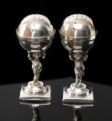 PAIR VICTORIAN NOVELTY FIGURAL CRUETS, Stokes & Ireland, London 1896, modelled as putti holding