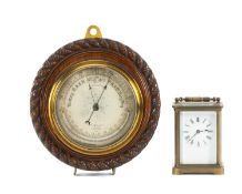 LATE VICTORIAN CARVED OAK ANEROID BAROMETER by J. Hicks, London, 19.5cms (diam.); and French brass