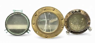 BRONZE SHIP'S PORTHOLE with glass window and retaining clasps, 48cms (diam.); another, 39cms (