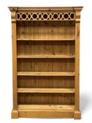 MODERN PINE TALL BOOKCASE with decorative pierced pelmet and fixed shelves, 188 (h) x 120 (w) x