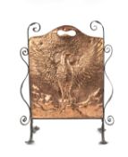 ARTS & CRAFTS PERIOD HAMMERED COPPER & WROUGHT IRON FIRE SCREEN, decorated with an eagle with