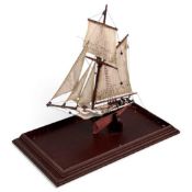 UNUSUAL & DECORATIVE MODEL SAILING BOAT, formed from the vertebra of a porpoise, cased, 42 x 42cms
