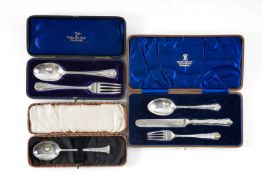 TWO SILVER CHRISTENING SETS, and a cased Etruscan style silver spoon, gross weight 5.8ozt