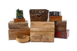 VARIOUS WOODEN TRINKET BOXES, some carved and inlaid, fossil box, wooden waste bin, etc. Provenance: