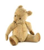 LARGE ENGLISH GOLDEN PLUSH LOVE-WORN TEDDY BEAR, 64cms (l) Provenance: private collection