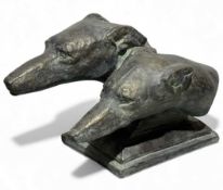 BRONZED STONEWARE SCULPTURE OF TWO DOG'S HEADS, on a square stepped base, 29 (h) x 25 (w) x 43cms (