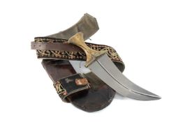 MIDDLE EASTERN JAMBIYA / KHANJAR, horn hilt, mounted in white metal, decorative leather scabbard and