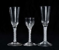 NEAR PAIR OF GEORGE III OPAQUE TWIST WINE GLASSES, c. 1780, 19cms (h); and Georgian opaque twist