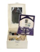 CREAM-COLOURED JEWELLERY BOX CONTAINING MIXED COSTUME JEWELLERY, including some silver brooches,
