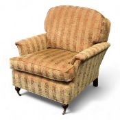 MODERN LARGE STRIPED UPHOLSTERED EASY CHAIR, on brass castors, 90 (h) x 92 (w) x 102cms (d)