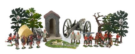 BRITAIN'S LEAD FARMYARD FIGURES, including village pond, trees, together with a tin-plate field gun,