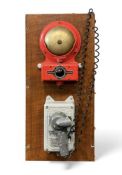 VINTAGE CHADBURNS OF LIVERPOOL WRONG WAY ALARM INDICATOR, red metal casing and brass bell, with a