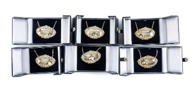 SET OF SIX BOXED SILVER DECANTER LABELS & CHAINS, each repoussé decorated with grapes and shells, '