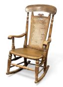 VINTAGE ROCKING CHAIR with cane and high back, 104 (h) x 62 (w) x 46cms (d) Provenance: private