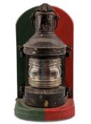 VINTAGE SHIP'S TOP LIGHT, black metal casing, on red and green painted stand, 42cms (h)