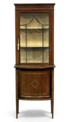 EDWARDIAN MAHOGANY NARROW DISPLAY CABINET with glazed single door to the top, and a convex