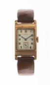 9CT GOLD SWISS TANK WATCH, silvered dial with retailer 'Camerer Cuss & Co.', subsid. secs,