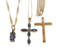 THREE 9CT GOLD PENDANT ON CHAINS comprising sapphire and diamond chip, sapphire cross and gold