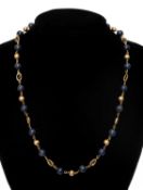 EGYPTIAN 18K GOLD & BLUE HARDSTONE BEAD NECKLACE, with brushed gold bead and S-links, Cairo .750