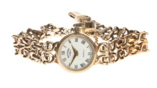 9CT GOLD ROTARY QUARTZ LADIES' WRISTWATCH, round cream dial with Roman numerals, integrated 9ct gold