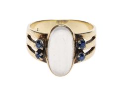 14CT GOLD MOONSTONE & SAPPHIRE DRESS RING, the central stone approx. 14 x 7mms, flanked by four