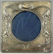 EDWARDIAN ART NOUVEAU SILVER-MOUNTED PHOTOGRAPH FRAME, decorated with stylised floral motifs,