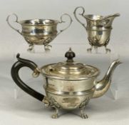 GEORGE V SILVER THREE-PIECE TEA SERVICE of circular form, each standing on four paw feet, Joseph