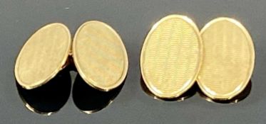 PAIR OF 9CT GOLD CUFFLINKS, the oval panels with engine turned designs, 6g Provenance: private