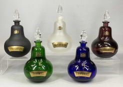 FIVE ROYAL PHARMACEUTICAL SOCIETY APOTHECARY BOTTLES, each of a different colour and labelled in