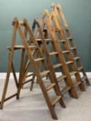 VINTAGE WOODEN STEP LADDERS, four sets with slat step tops, 184cms (h) the tallest Provenance: