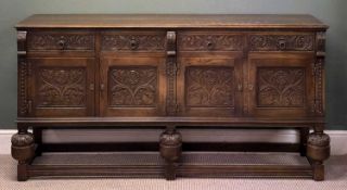 FINE EDWARDIAN CARVED OAK SIDEBOARD, four drawers over four cupboard doors, on bulbous and block