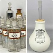 19TH CENTURY GLASS APOTHECARY BOTTLES, labelled in Latin, ten clear and three amber, 24cms (h) the