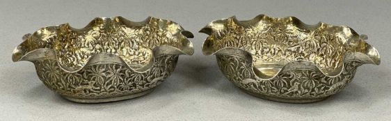 PAIR OF EASTERN GILDED WHITE METAL BOWLS, oval form with ruffle bowls, ornate repoussé decoration, 4