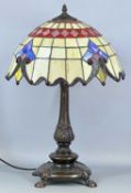 TIFFANY STYLE TABLE LAMP, with bronzed cast resin base and red beaded stained shade, 64cms (h)