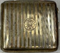 GEORGE V SILVER CIGARETTE CASE of curved rectangular design, engine turned decoration, monogram