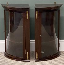 PAIR OF MODERN MAHOGANY WALL HANGING CORNER CUPBOARDS, with single glazed door and brass mounts,