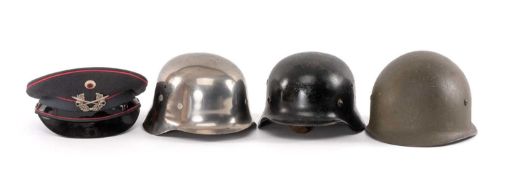 MILITARY CLUB HOUSE: GERMAN HELMETS, to include an M42 steel helmet with two vent holes, rolled