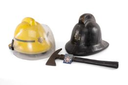 SERVICES CLUB HOUSE: TWO FIRE HELMETS, to include a late '50s cork and leather helmet, size M, inner