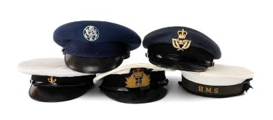 MILITARY CLUB HOUSE: MILITARY CAPS, to include Royal Navy Commissioned Officer's peaked cap, with
